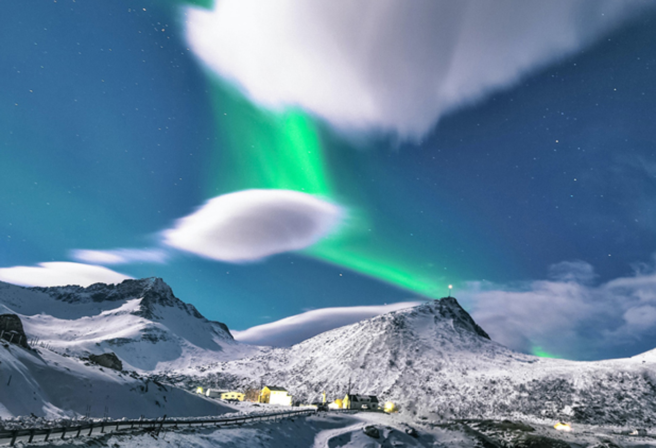 Northern lights over a snowy town